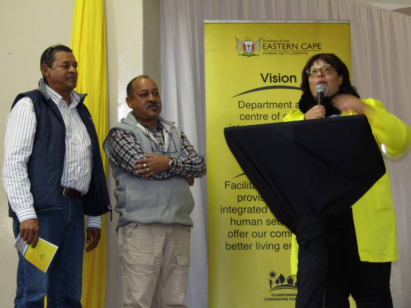 Human Settlements MEC Helen Sauls-August introduces contractors Theo and Malcolm Langson to the Pellsrus community.