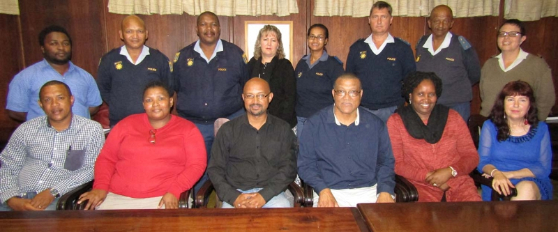 Kouga Social Services Portfolio Councillor Danny Benson (front row third right) and the municipality’s Health and Social Services Manager Nomvula Machelesi presided over the election of the new Kouga Local Drug Action Committee on Thursday. The members are: (front row from left) Marshall Geswint (faith based sector), Gene Thube (Secretary), Carvin Jaars (Chairperson), Estelle Gelderblom from Social Development, (back row from left) Kouga’s Special Programmes Officer Vuyani Zana,  SAPS’ Alie Felix and Joseph Klaasen, Nita Mentz from the National Prosecuting Authority,  SAPS’ Elmarie Jantjies, Erhard Wagener and Brian Perils.