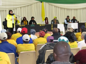 Human Settlements MEC Helen Sauls-August addresses residents at the hand-over ceremony.
